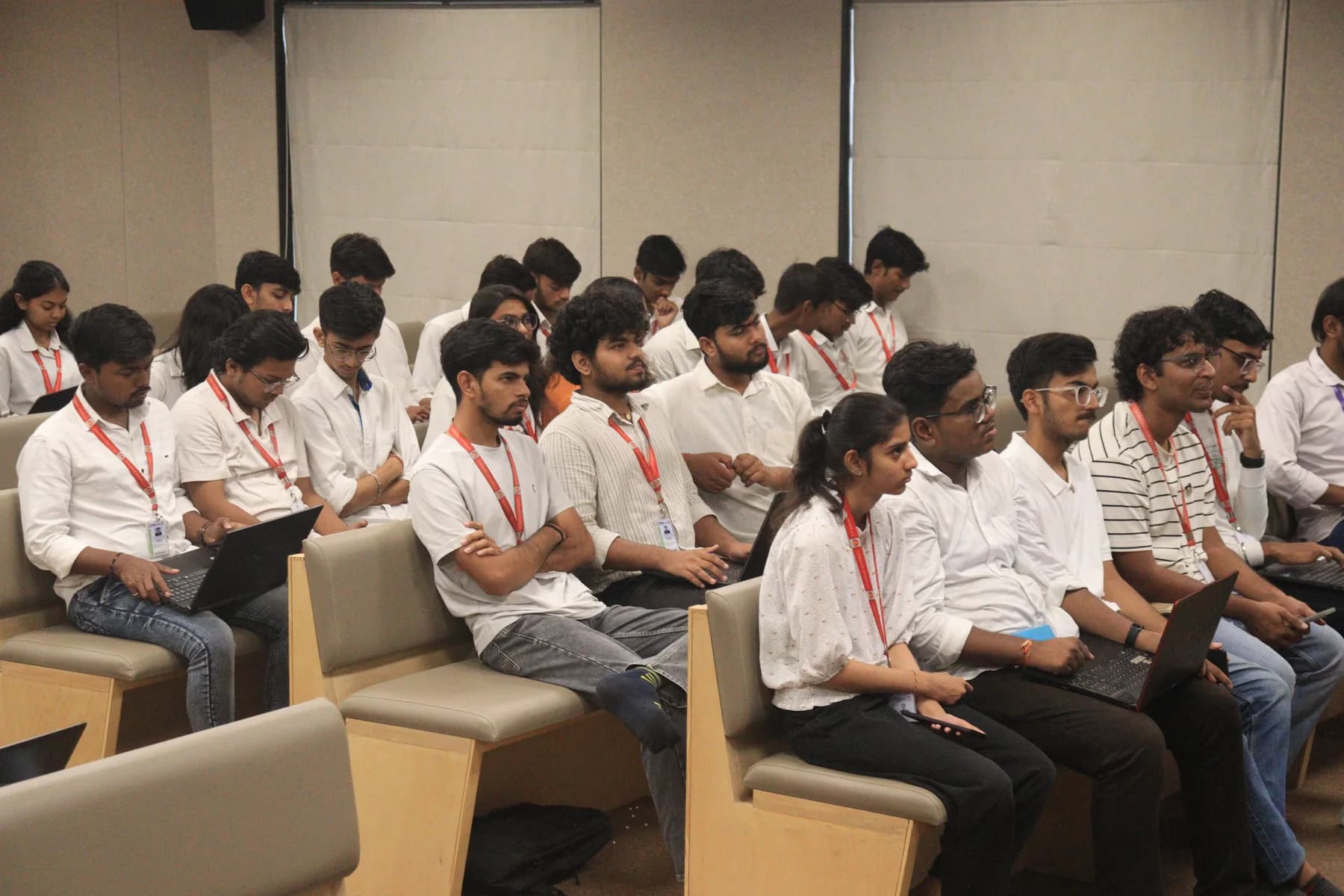 PPSU students following a community session with laptops open